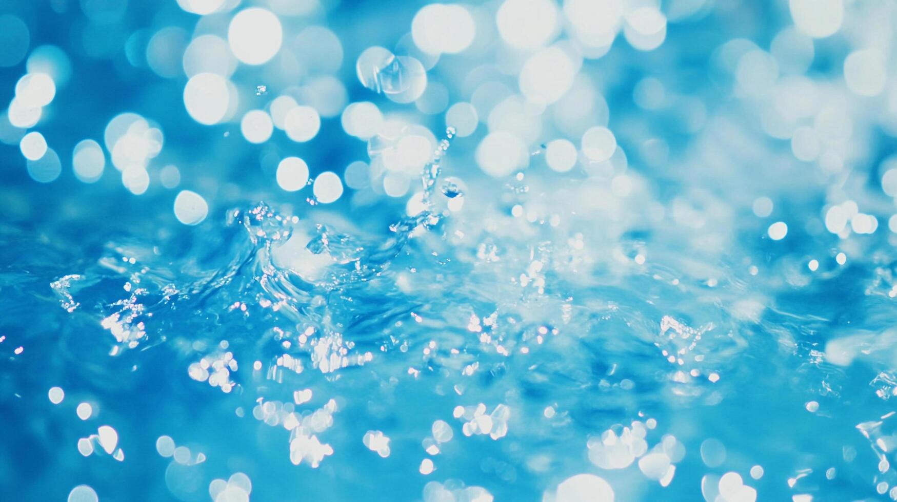 Splashing water creates abstract patterns with sparkling light. Refreshing, calming, and dynamic. Nature's beautiful display of water. photo