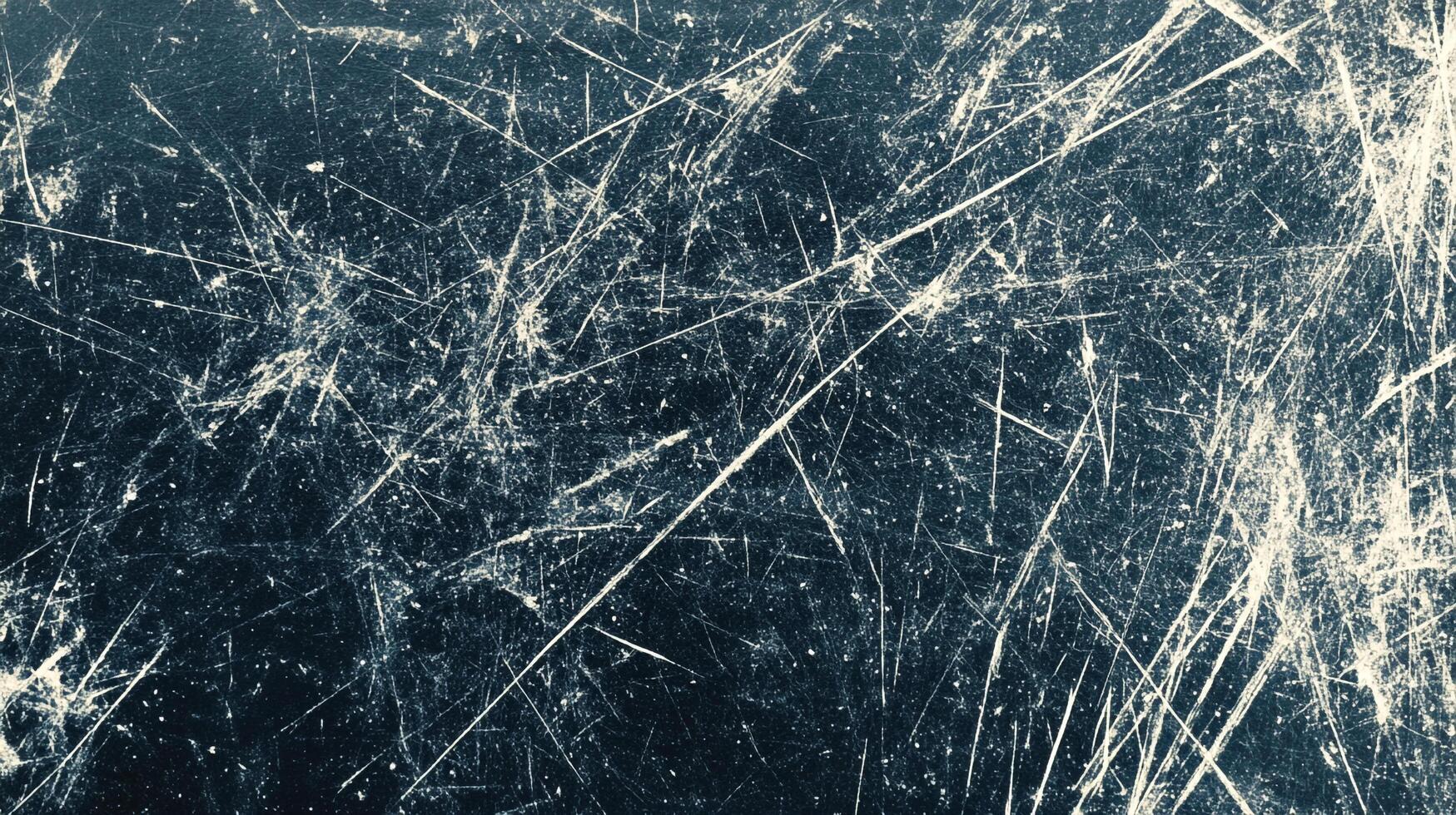 Texture featuring scratches, scrapes, and wear, creating a weathered surface with linear white markings on a dark blue background. photo