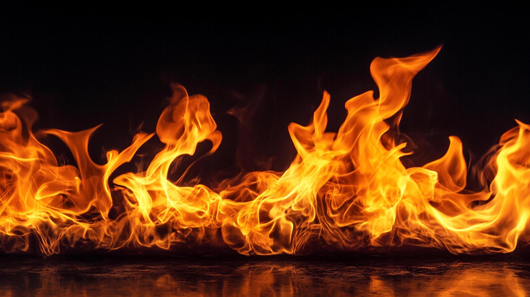 Flames dance vividly against a dark backdrop, showcasing radiant hues of orange and yellow in a captivating display of heat and energy. photo