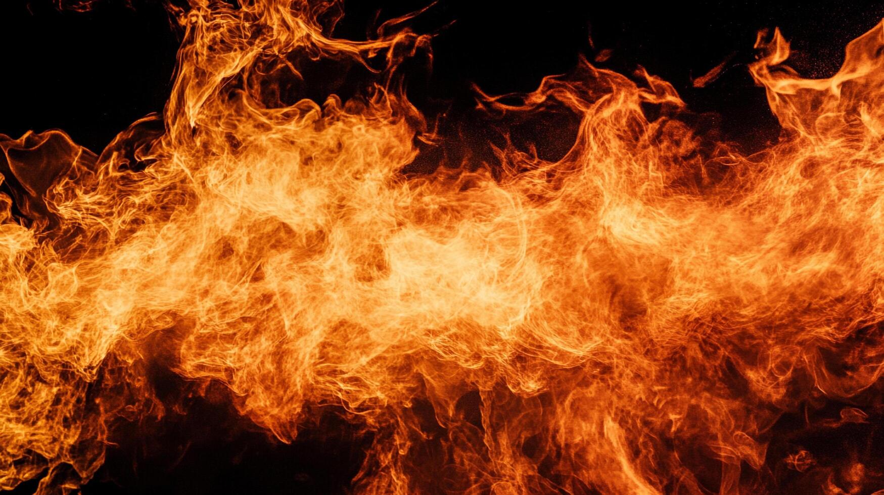 Abstract fiery orange blaze against a dark backdrop showcasing intense heat and dynamic energy. A symbol of power and transformation. photo