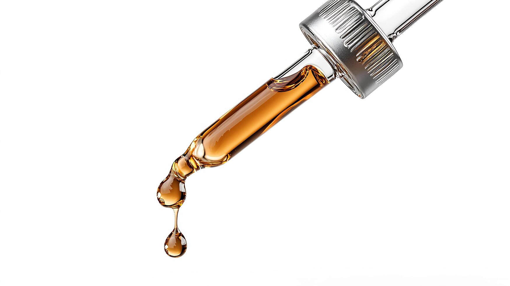 A syringe filled with liquid is being poured into a glass photo