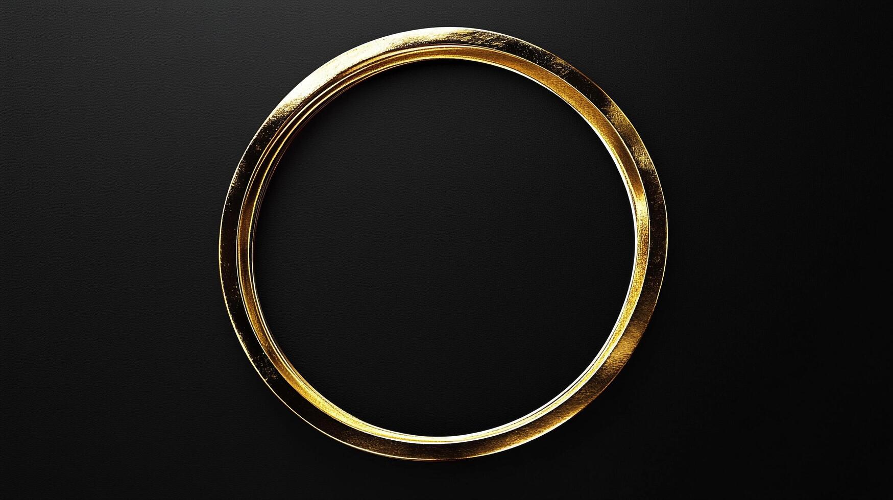 Elegant golden rings with textured surface set against a dark background, evoking luxury and design sophistication. photo