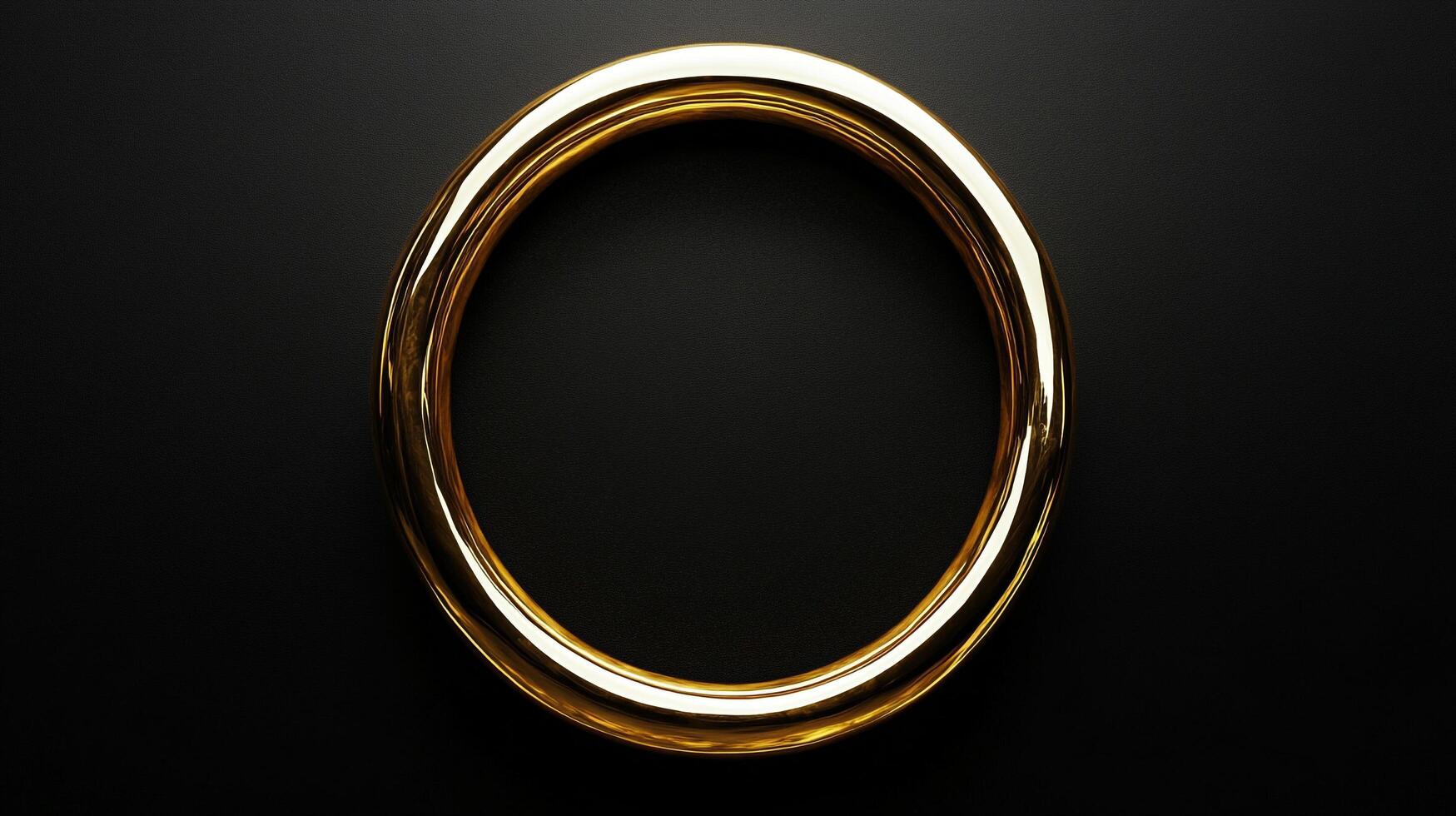 Striking gold ring against a deep, dark background. The smooth, reflective surface catches the light, highlighting its circular shape. photo