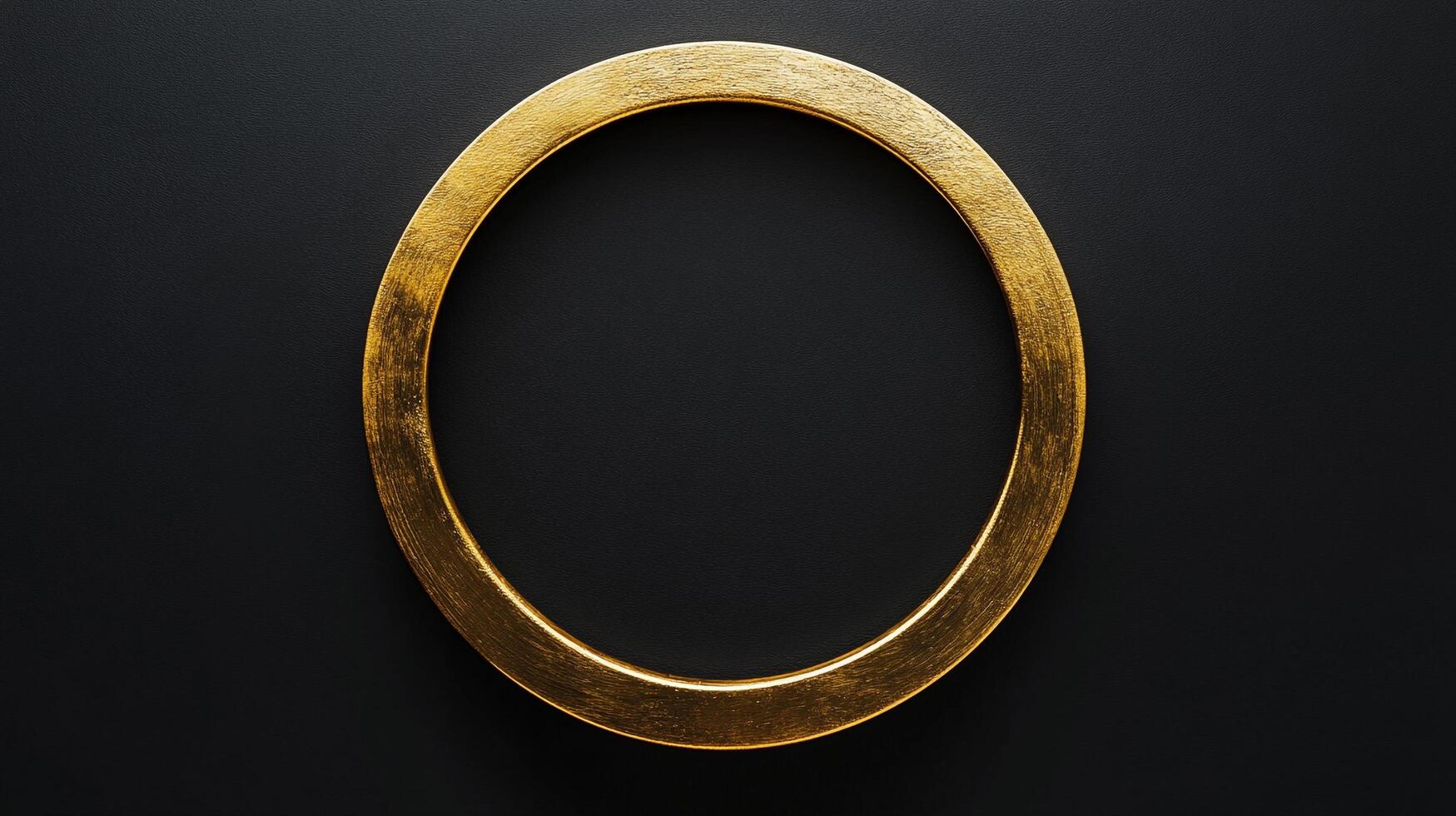 An eye-level close-up presents a golden circle against a black background, offering a minimalist yet striking visual composition. photo