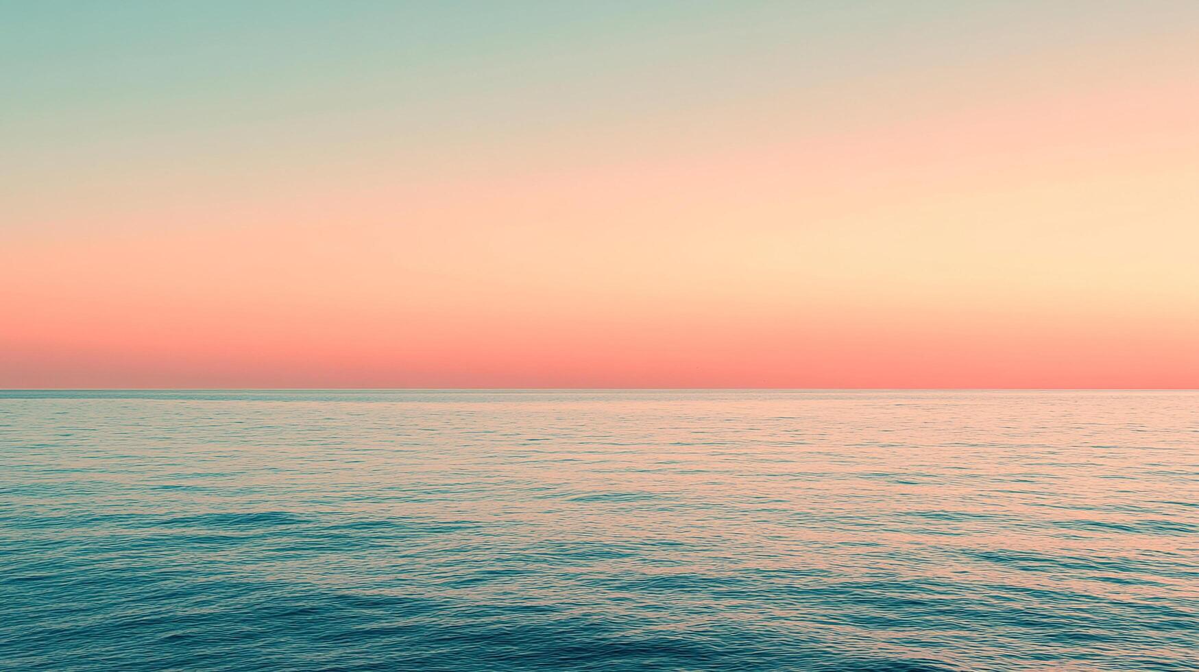 A breathtaking seascape showcasing a calm ocean at dusk, where the vibrant colors of the sky blend seamlessly with tranquil waters, evoking a sense of peace and serenity. photo