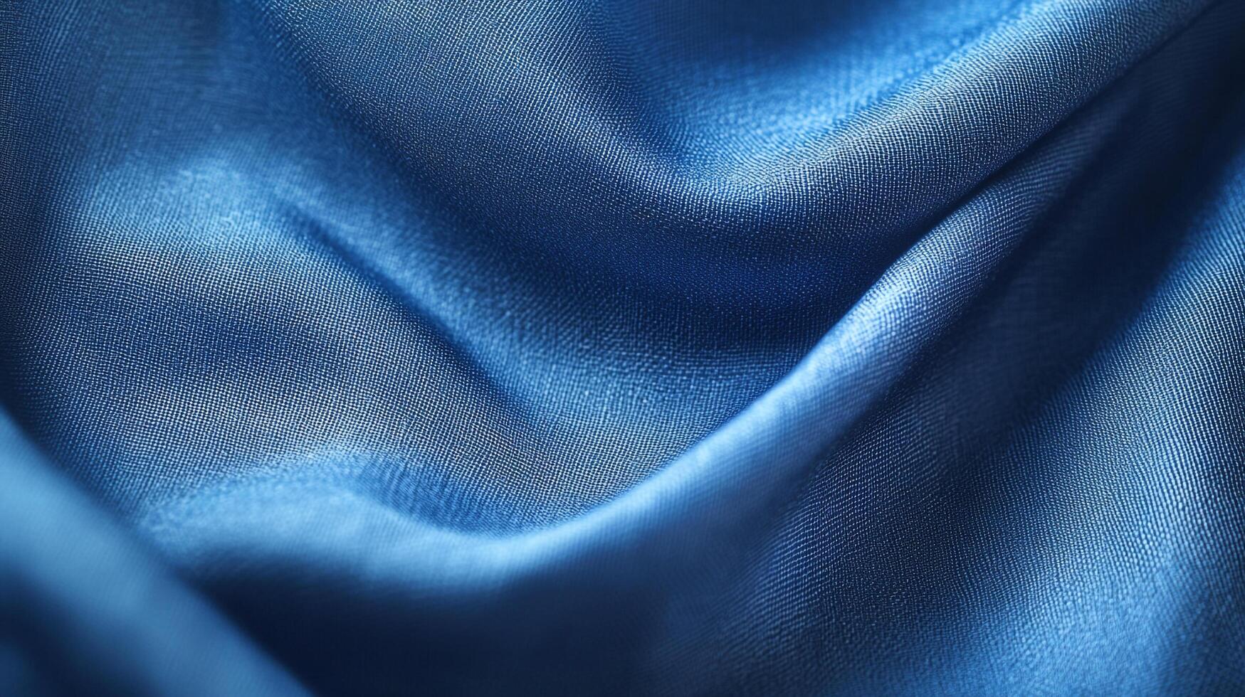 This image portrays deep blue satin fabric exhibiting soft, gentle waves, creating a serene and calming atmosphere, enhancing beauty in textile design. photo