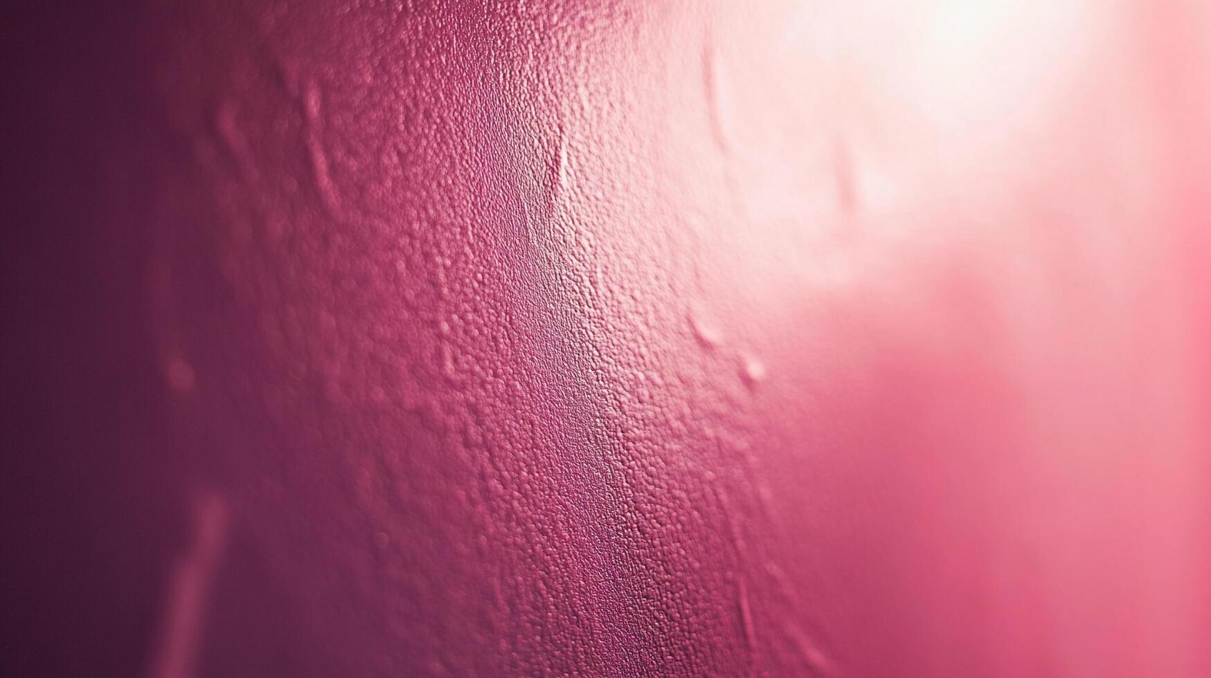 This close-up shot reveals a vibrant pink paint texture, showcasing its smooth surface and abstract patterns that evoke creativity and artistic exploration in modern design. photo