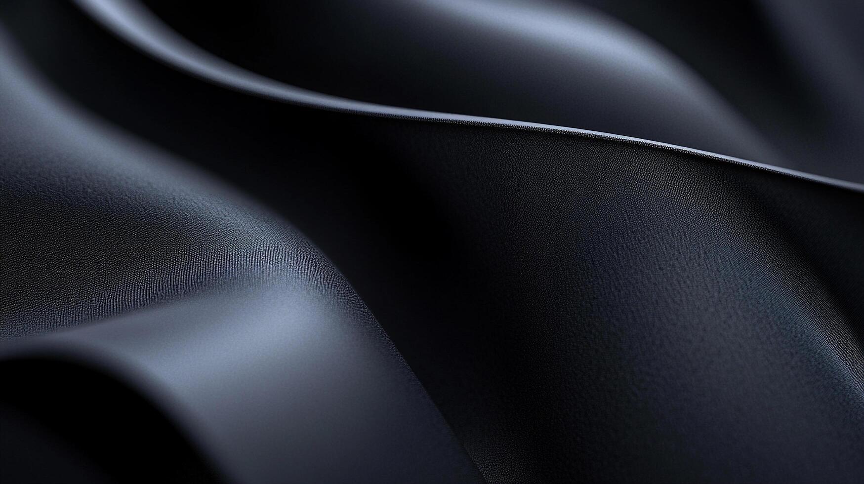A close-up of sleek black fabric, highlighting its smooth surface and intricate folds that create a powerful visual impact while representing sophistication and elegance. photo