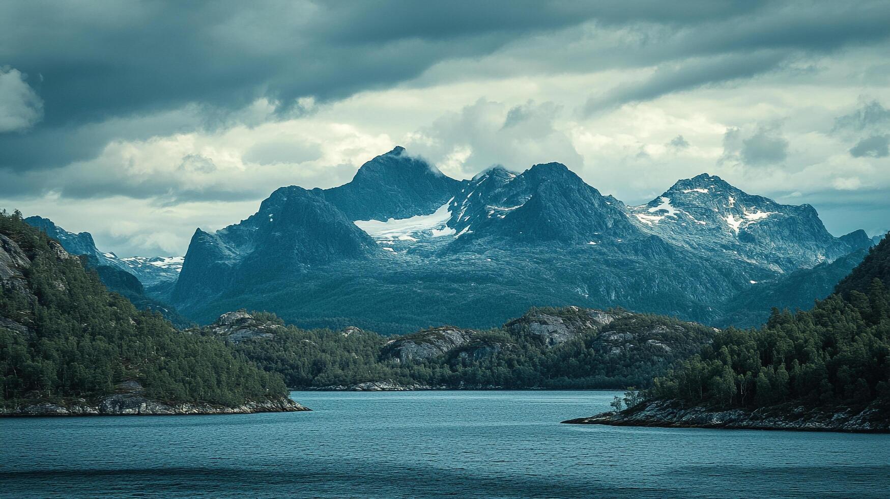 Misty mountains rise above the still water in this scenic landscape, promising adventure and tranquility in a natural setting. photo