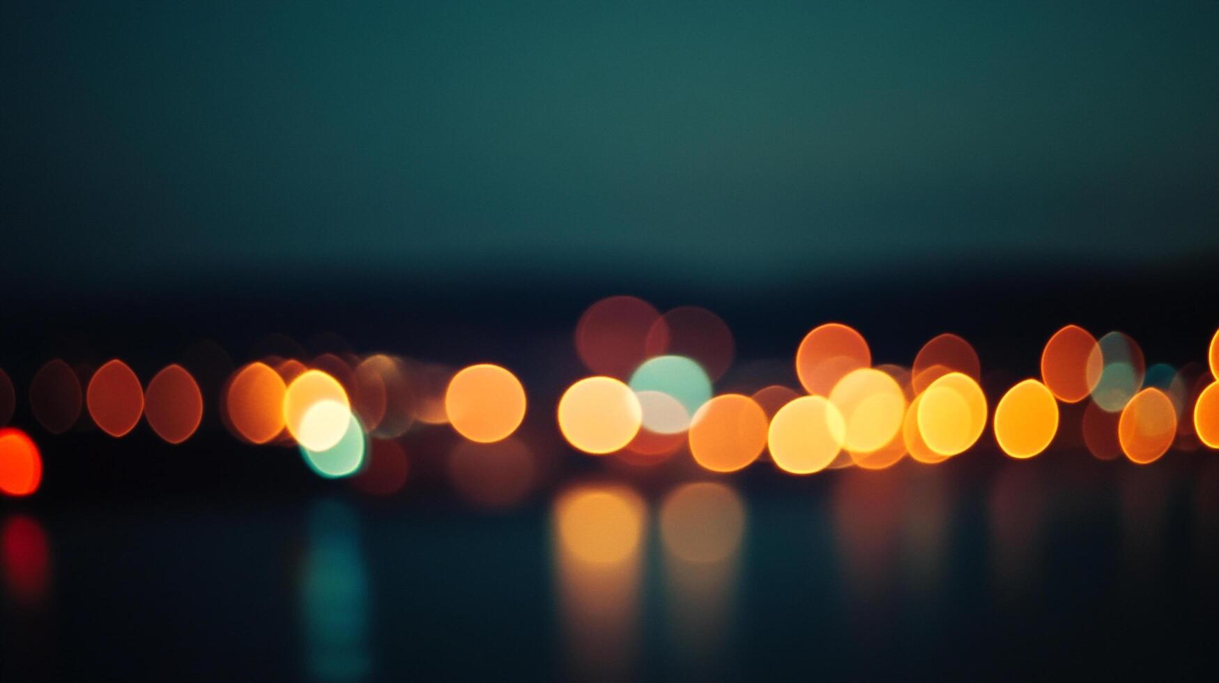 Blurred city lights shimmer, creating a dreamy abstract landscape with warm orange hues against a dark turquoise backdrop. photo