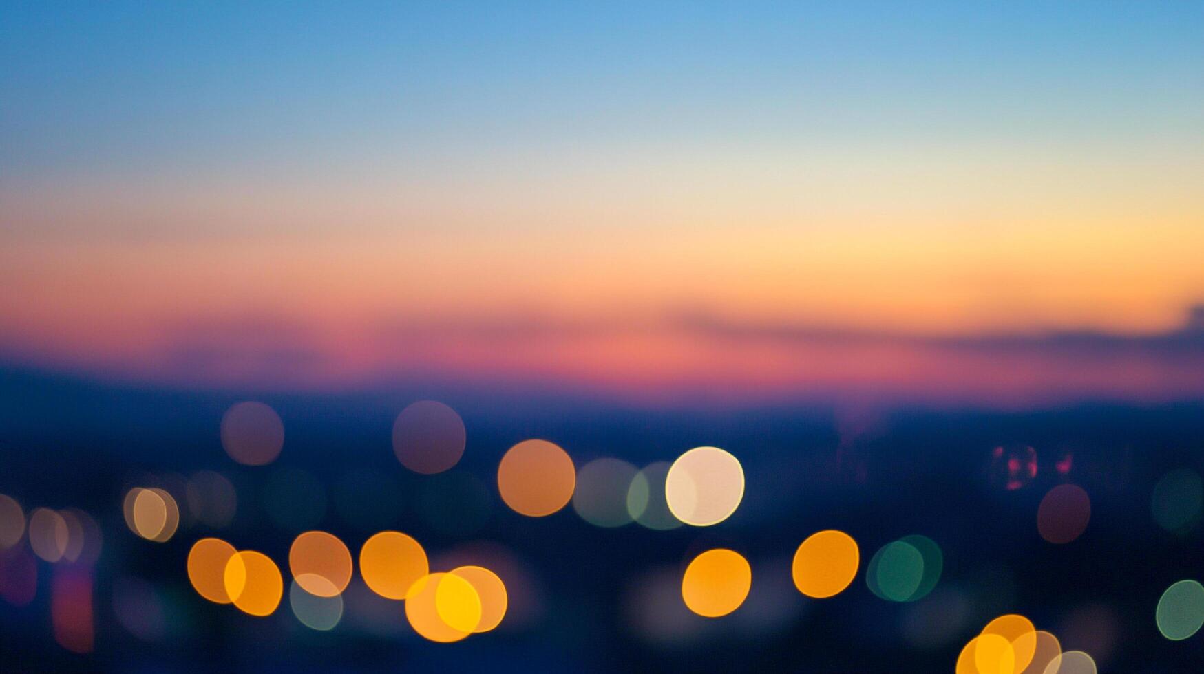 Dreamy city lights blur into the soft hues of a twilight sky, creating an ethereal and calming urban landscape. photo