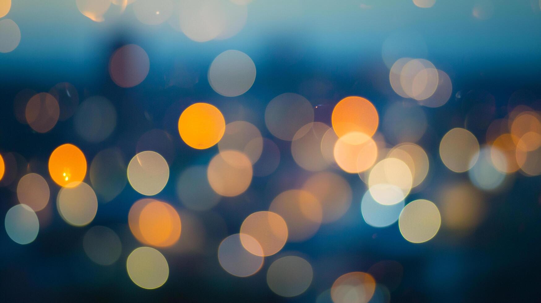 Aesthetic blurred lights creating a dreamy and abstract background with vibrant hues of orange, yellow, and blue. photo