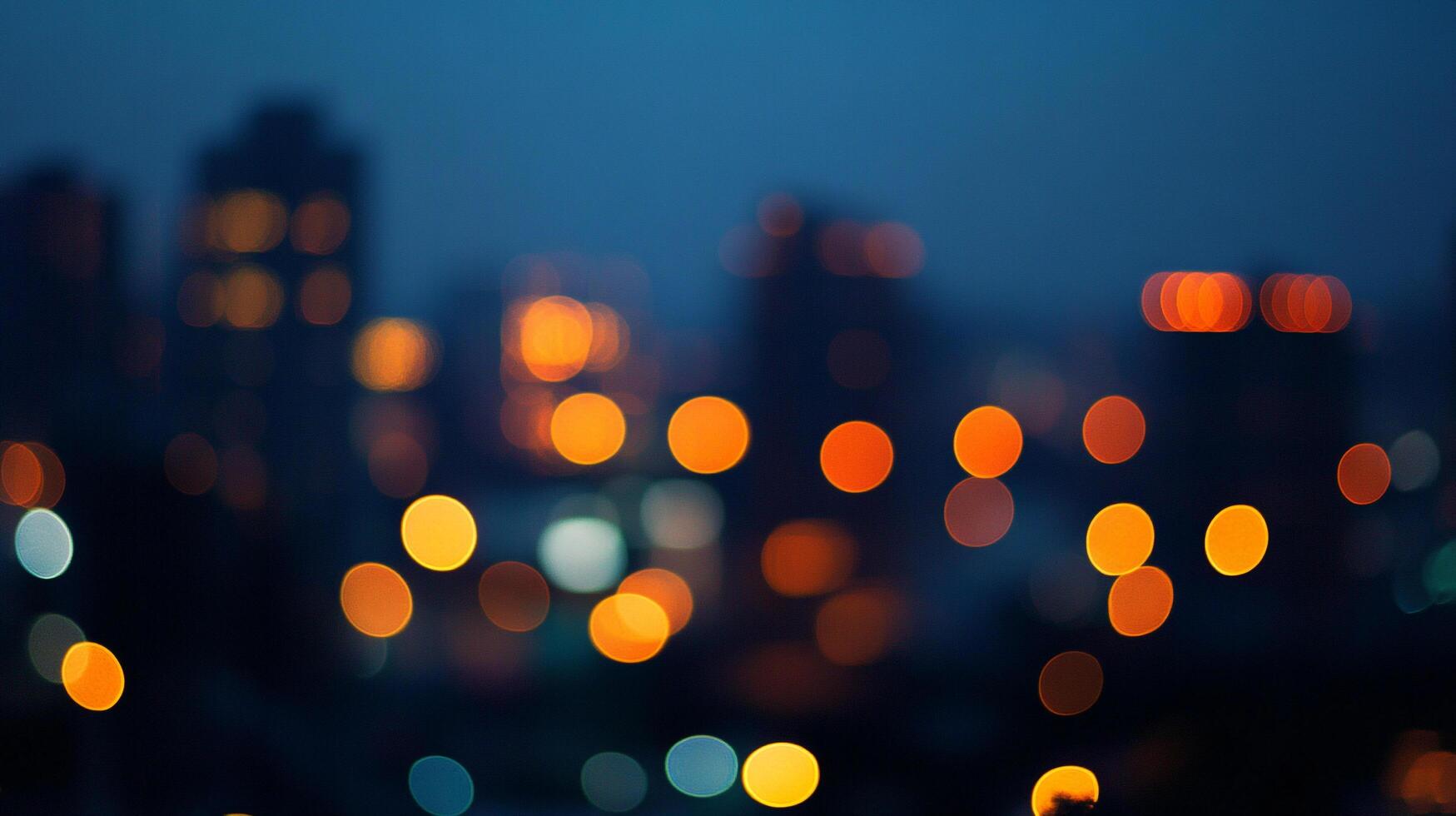 Blurred cityscape at night with glowing lights. Background is a soft blue. The circles of light are yellow, orange, and white. photo
