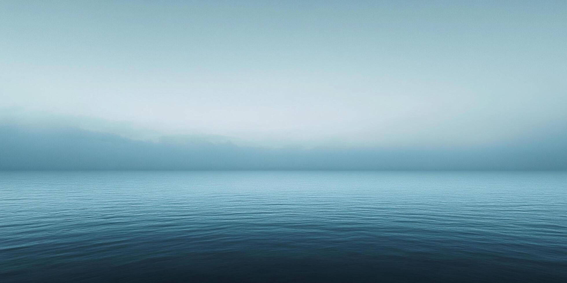 A calming view of the sea with a gradient of blues and whites, creating a sense of serenity, peace and minimalist beauty of the ocean. photo