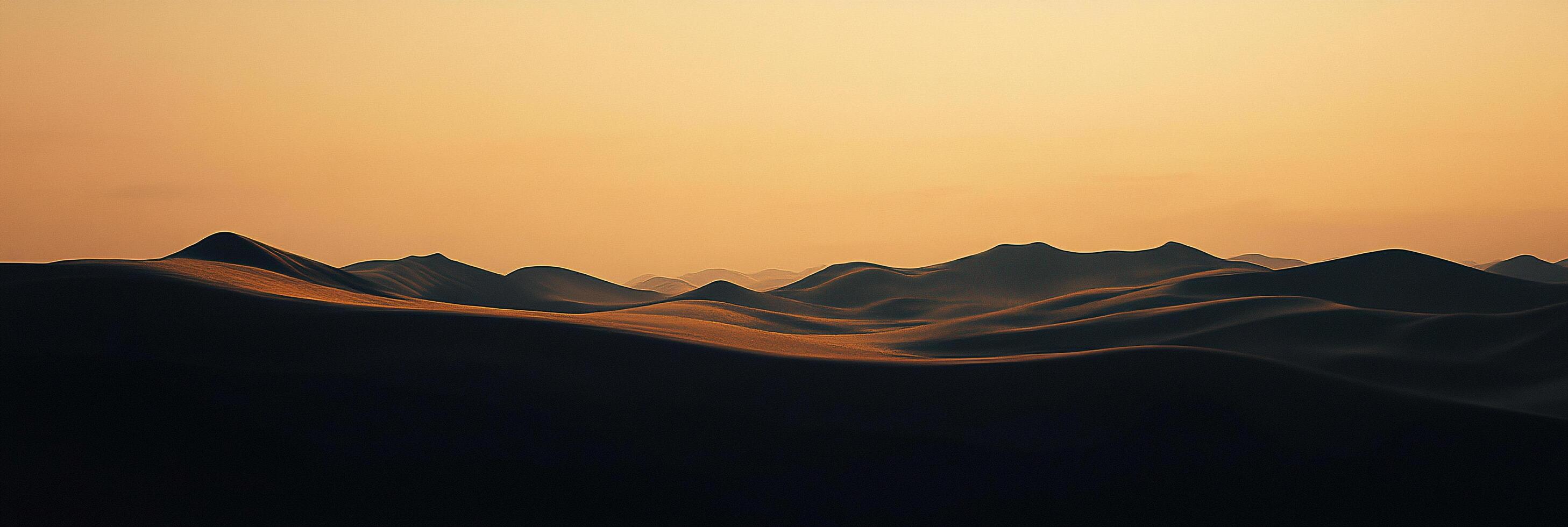 Desert landscape with golden light. Calm waves of sand create a surreal and peaceful environment during sundown. The perfect scenery. photo