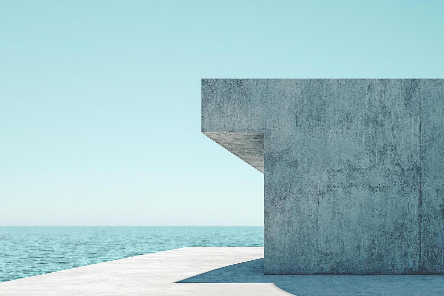 Minimalist concrete structure by the sea with clear blue sky, emphasizing architectural simplicity and serene coastal atmosphere. photo