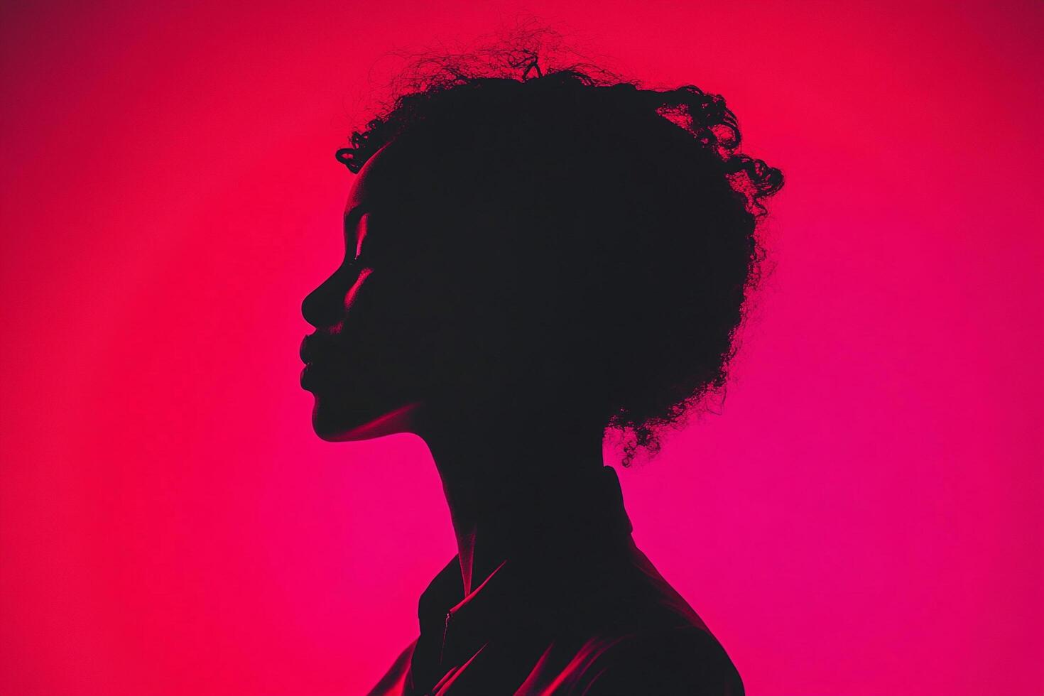 Silhouette of a person against a red backdrop, highlighted by soft lighting, evoking mystery and elegance. Timeless minimalist portrait. photo