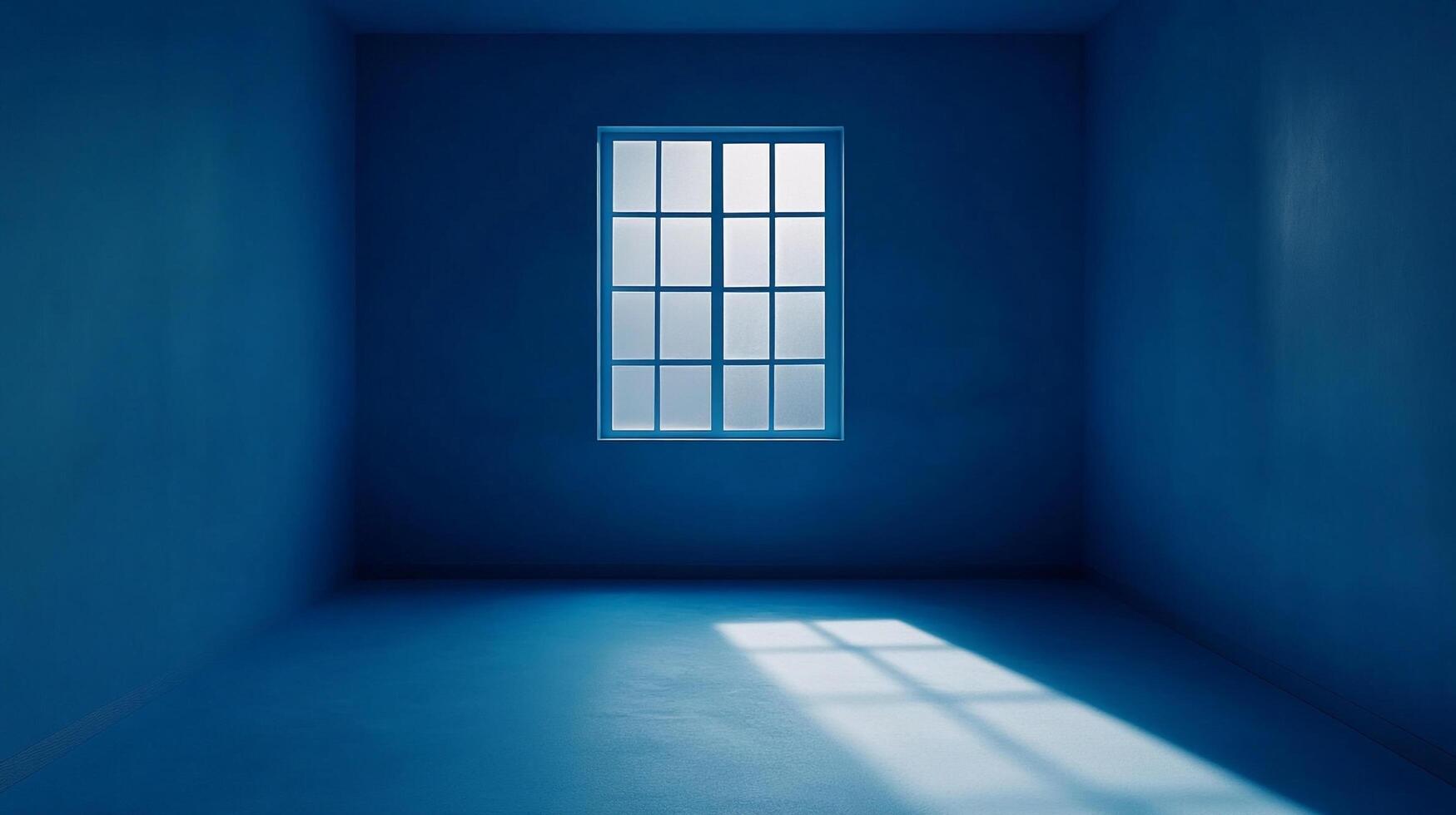 A minimalist blue room is illuminated by a single window, creating a serene and contemplative atmosphere with natural light. photo