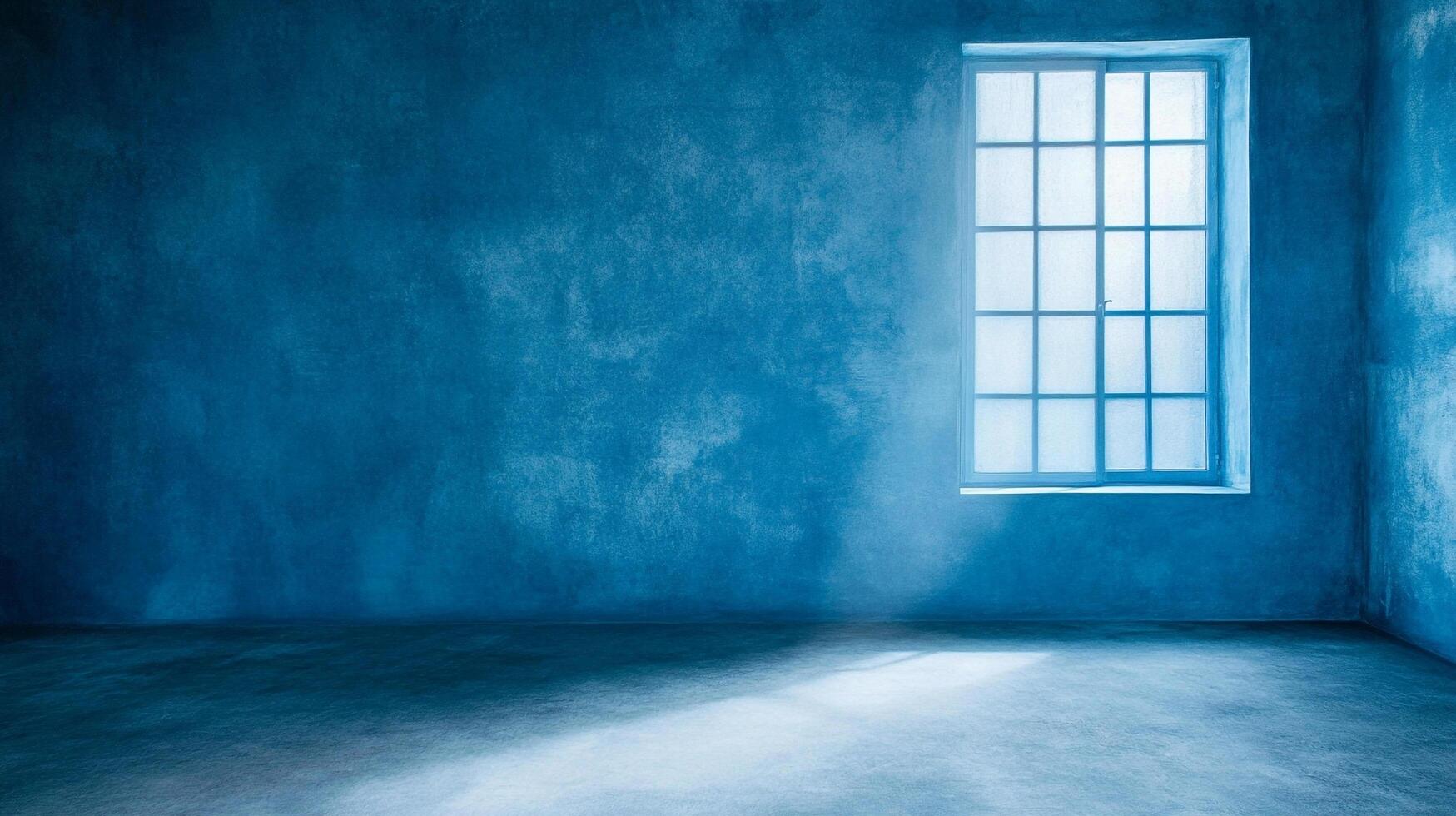 Minimalist interior featuring a window letting in light, bathed in blue hues. The concrete wall has texture and unique imperfections. photo