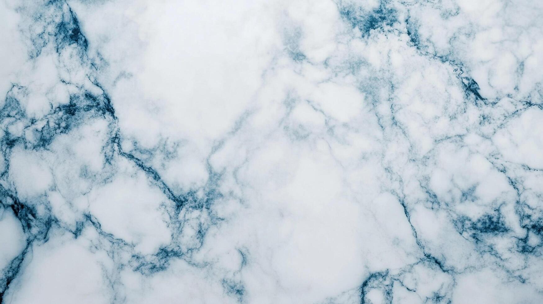 Elegant marble texture featuring a blend of whites and subtle blue-grey veining, perfect for backgrounds and surface design. photo