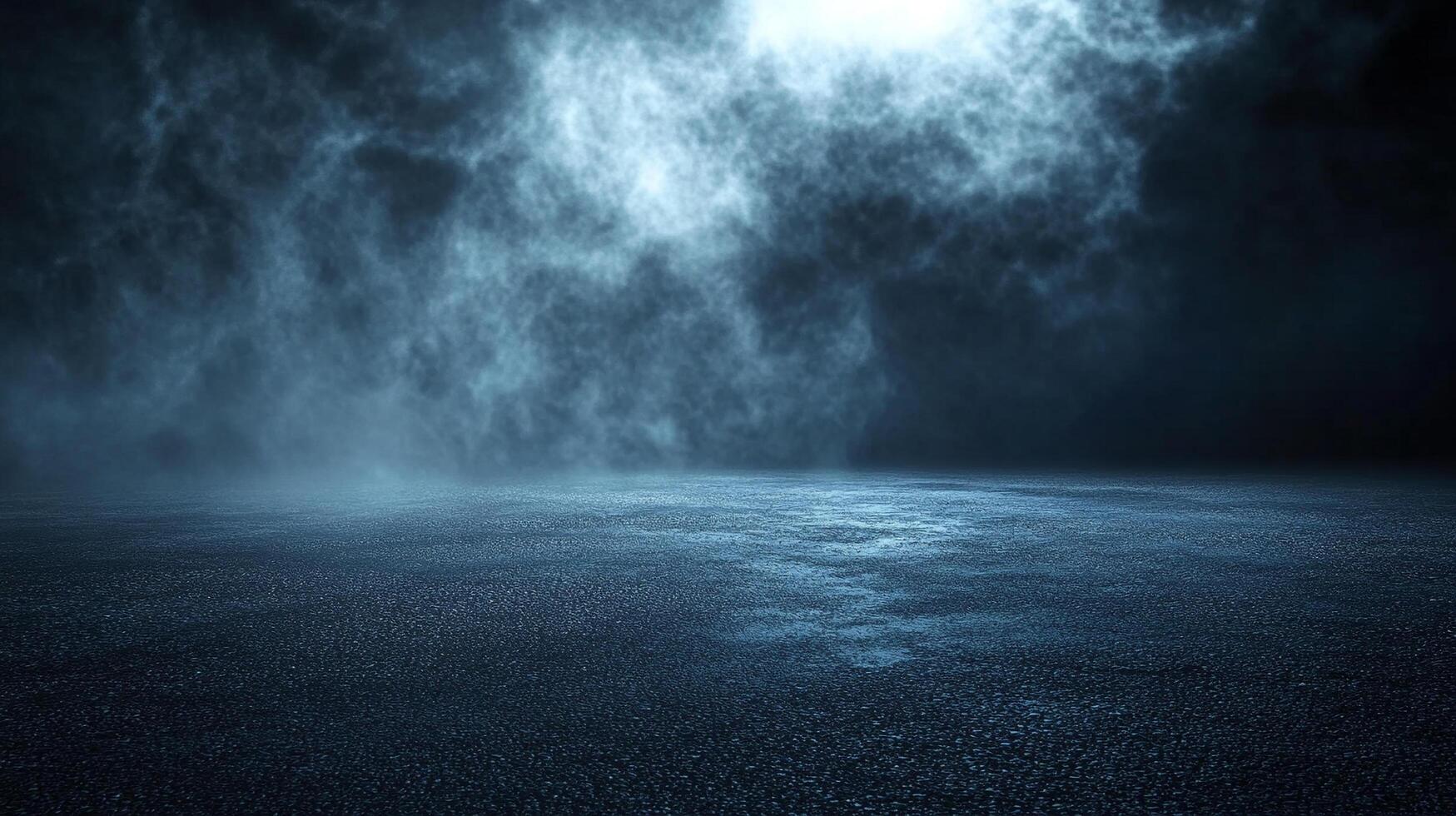 Dark sky with a foggy mist and a large empty field. The sky is filled with clouds and the mist is thick photo