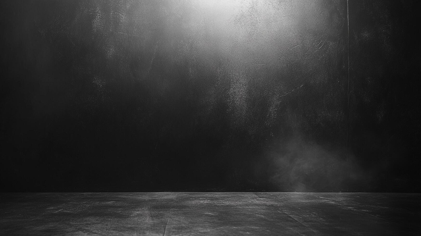 An abstract monochromatic shot of a textured wall and floor, illuminated by a single light source, creating a dramatic, minimalist scene. photo