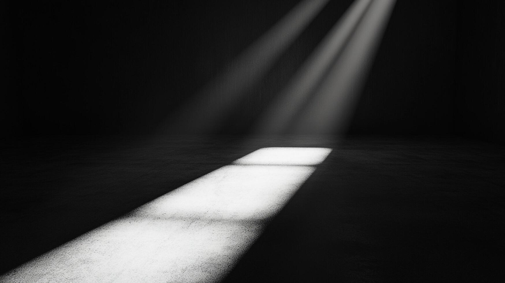 Rays of light filter into a dim room, illuminating a rectangular shape on the floor, creating a stark contrast between light and shadow. photo