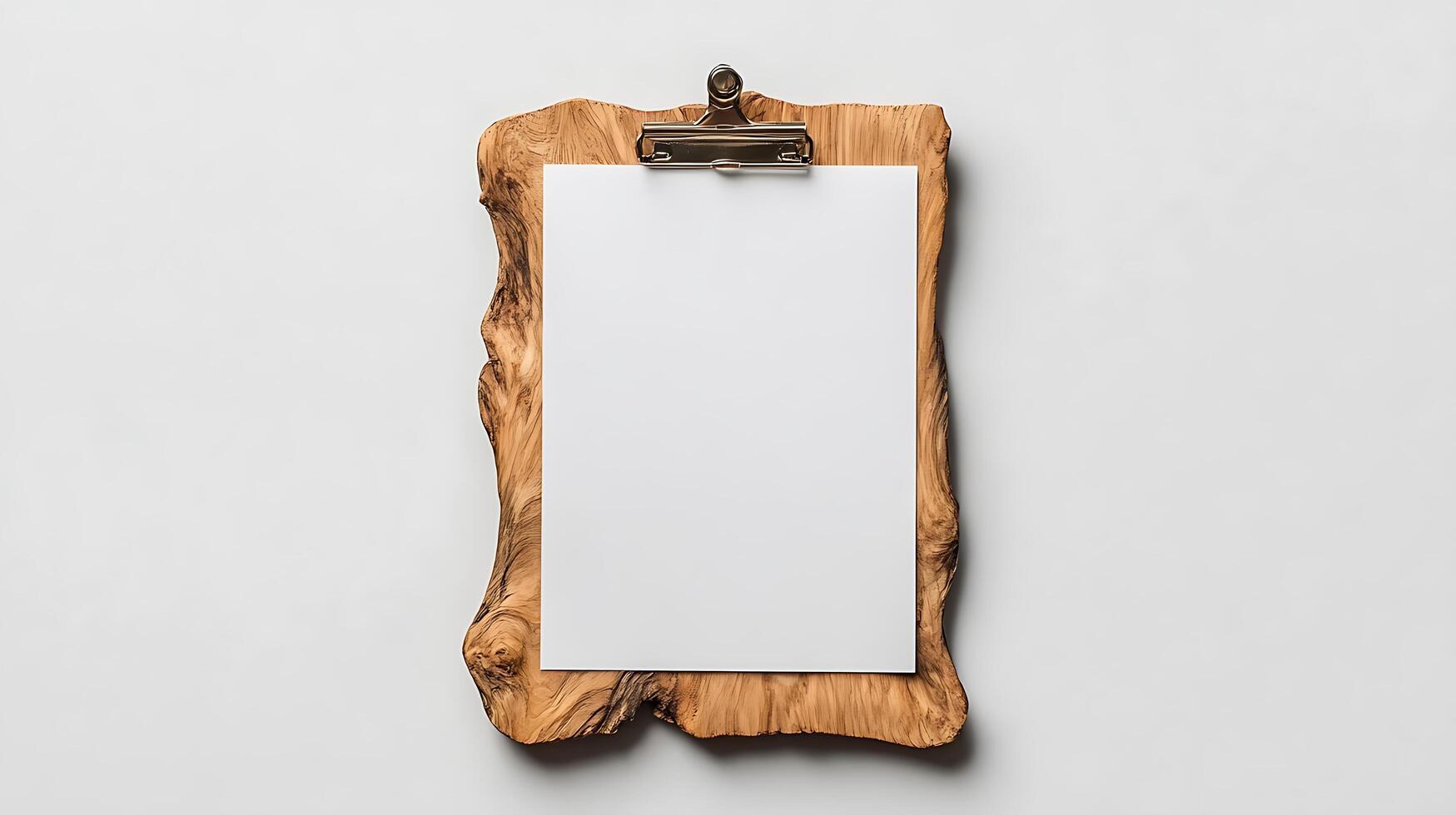 A clipboard with a blank piece of paper hanging on it photo