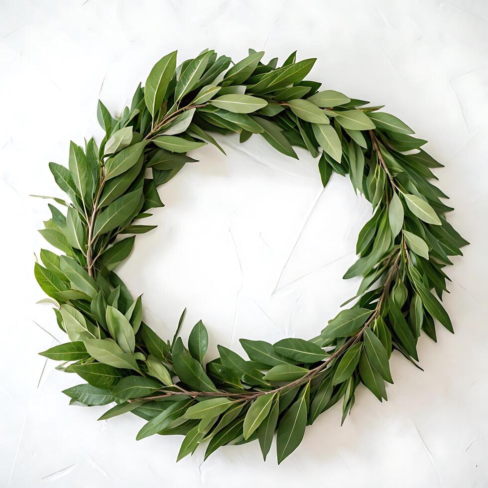 A beautiful green laurel wreath, carefully crafted with lush leaves, set against a clean white background, perfect for decoration or celebration photo