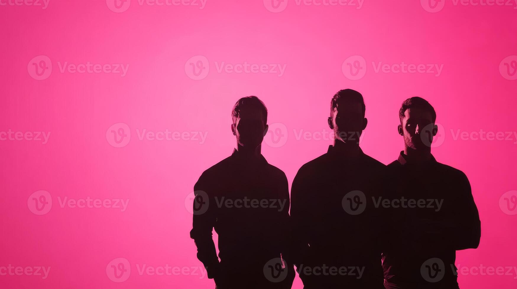 Three men silhouettes on pink backdrop photo