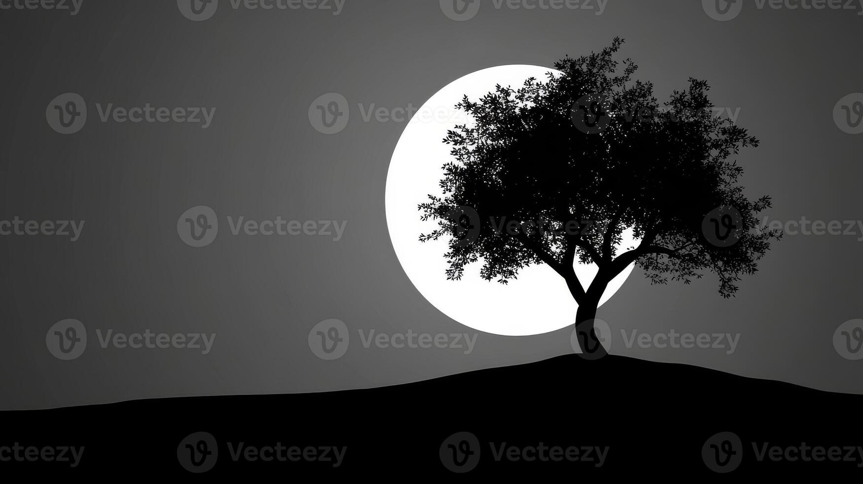 Tree silhouette against bright moon photo
