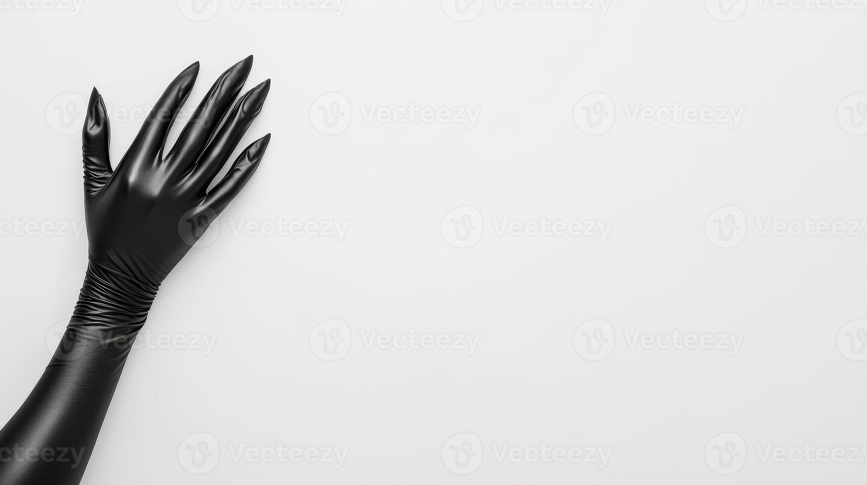 Black gloved hand against a plain white background photo