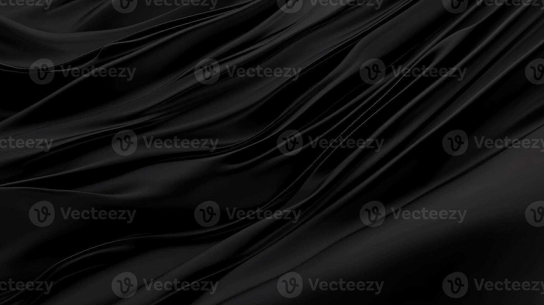 Elegant black fabric drapes softly in gentle waves photo