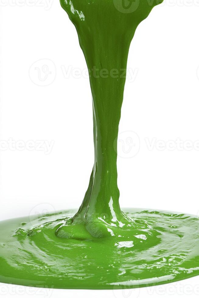 Bright green liquid flows and creates puddles on a surface photo