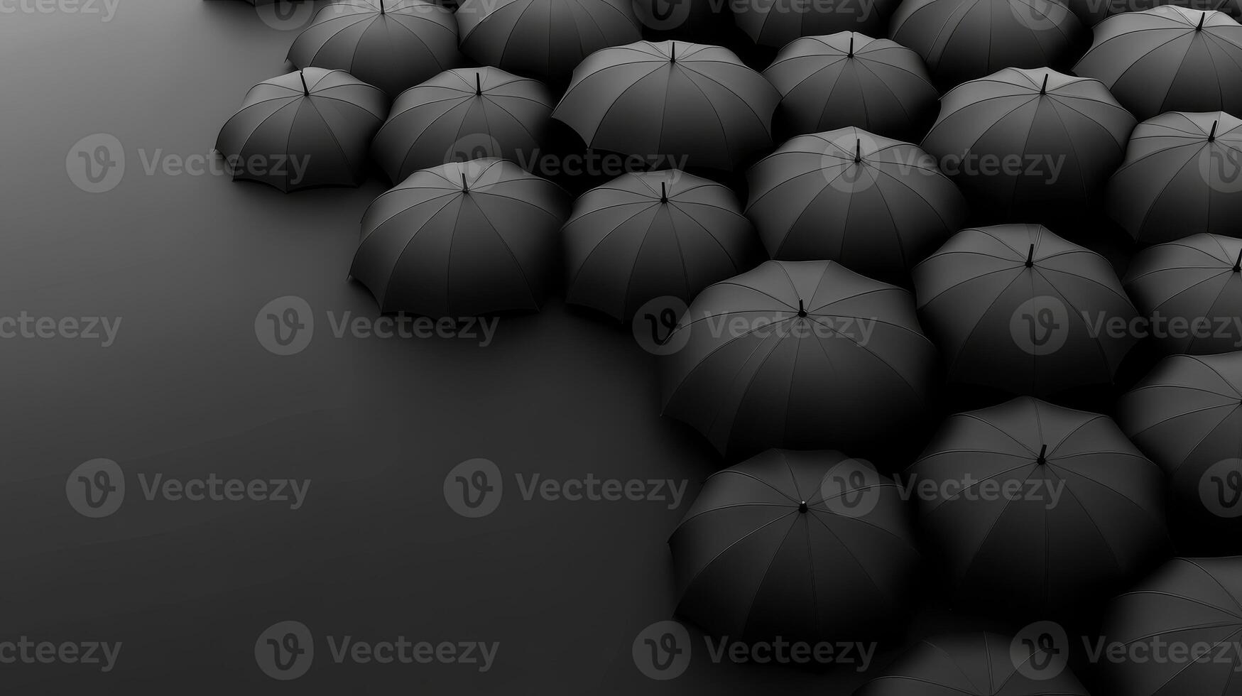 Unique array of black umbrellas on a smooth dark surface photo