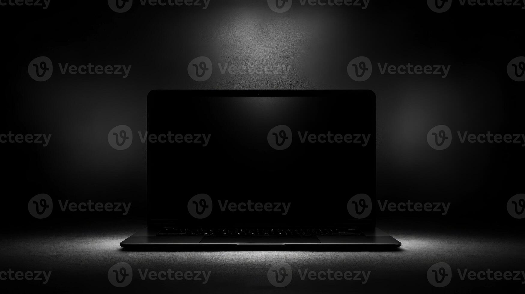 Lone laptop illuminated in darkness evokes mystery and creativity photo