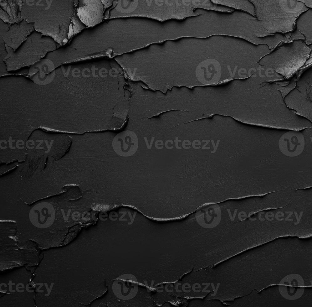 Texture of cracked black surface creates an abstract visual impact photo