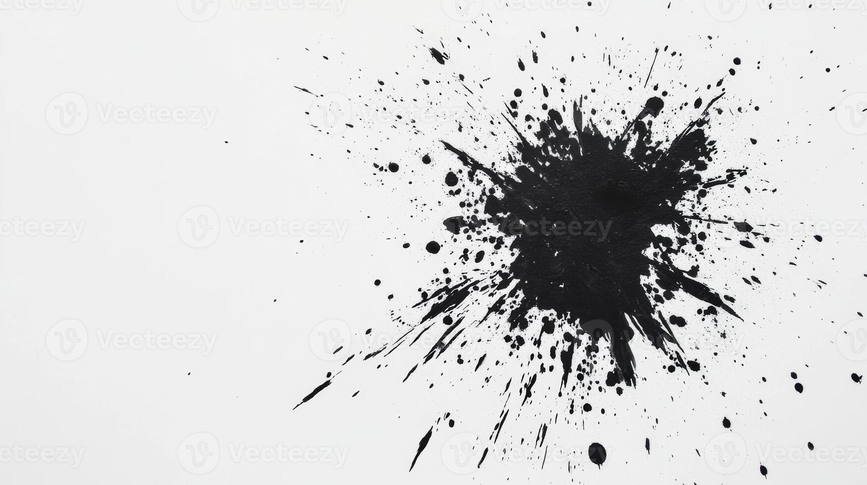 Bold black paint splatter creating a dramatic abstract effect photo