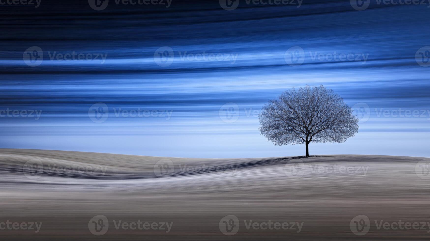 Solitary tree stands gracefully in a serene twilight landscape photo