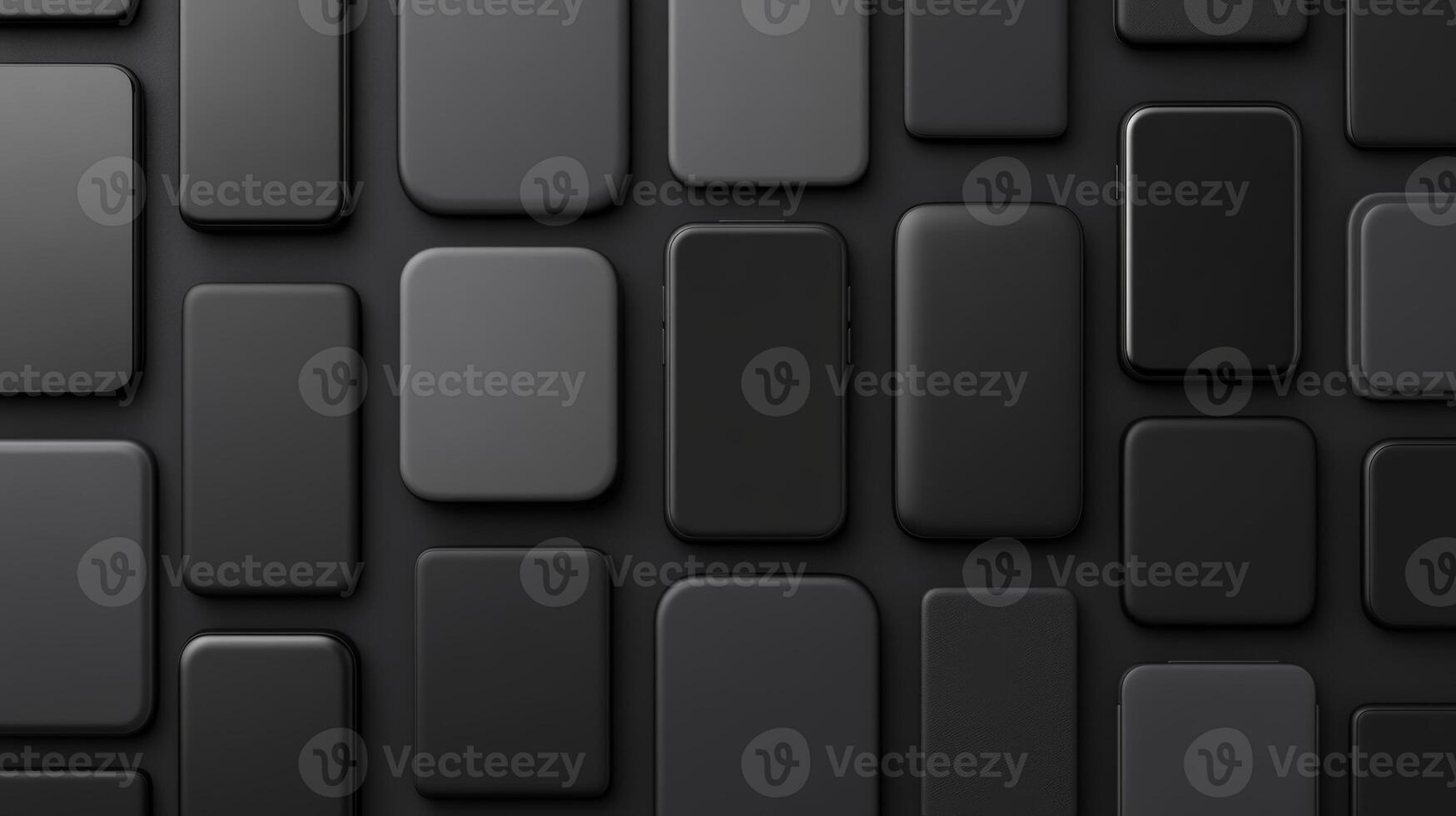 Multiple sleek black devices arranged on a dark textured surface photo