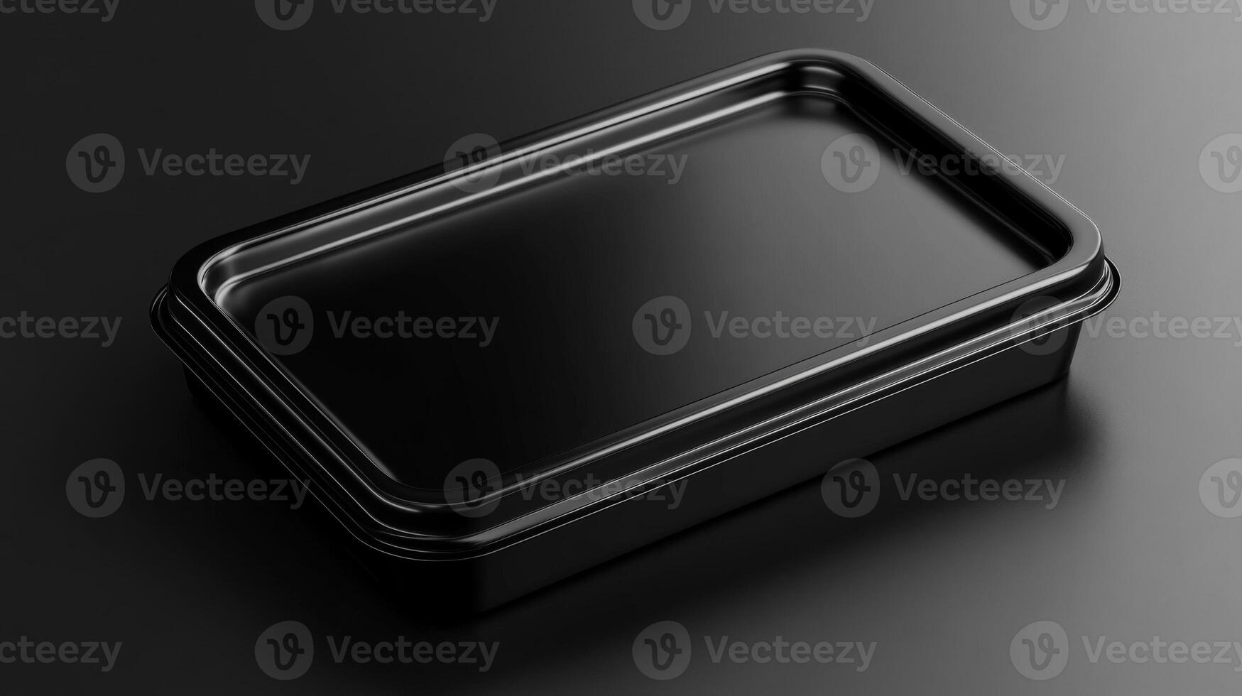 Black plastic container on dark surface expressing minimalism photo