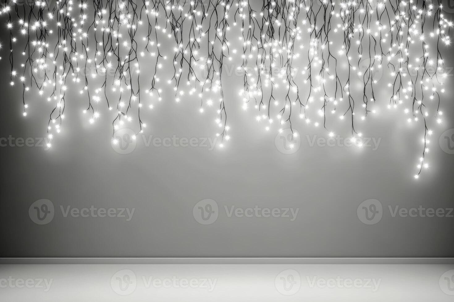 Delicate string lights illuminating a minimalist gray backdrop photo