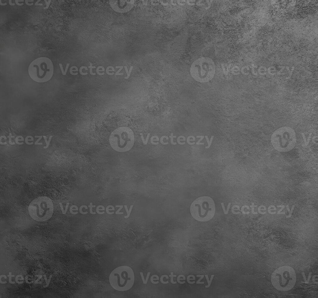 Textured dark surface with subtle variations in shade and tone photo