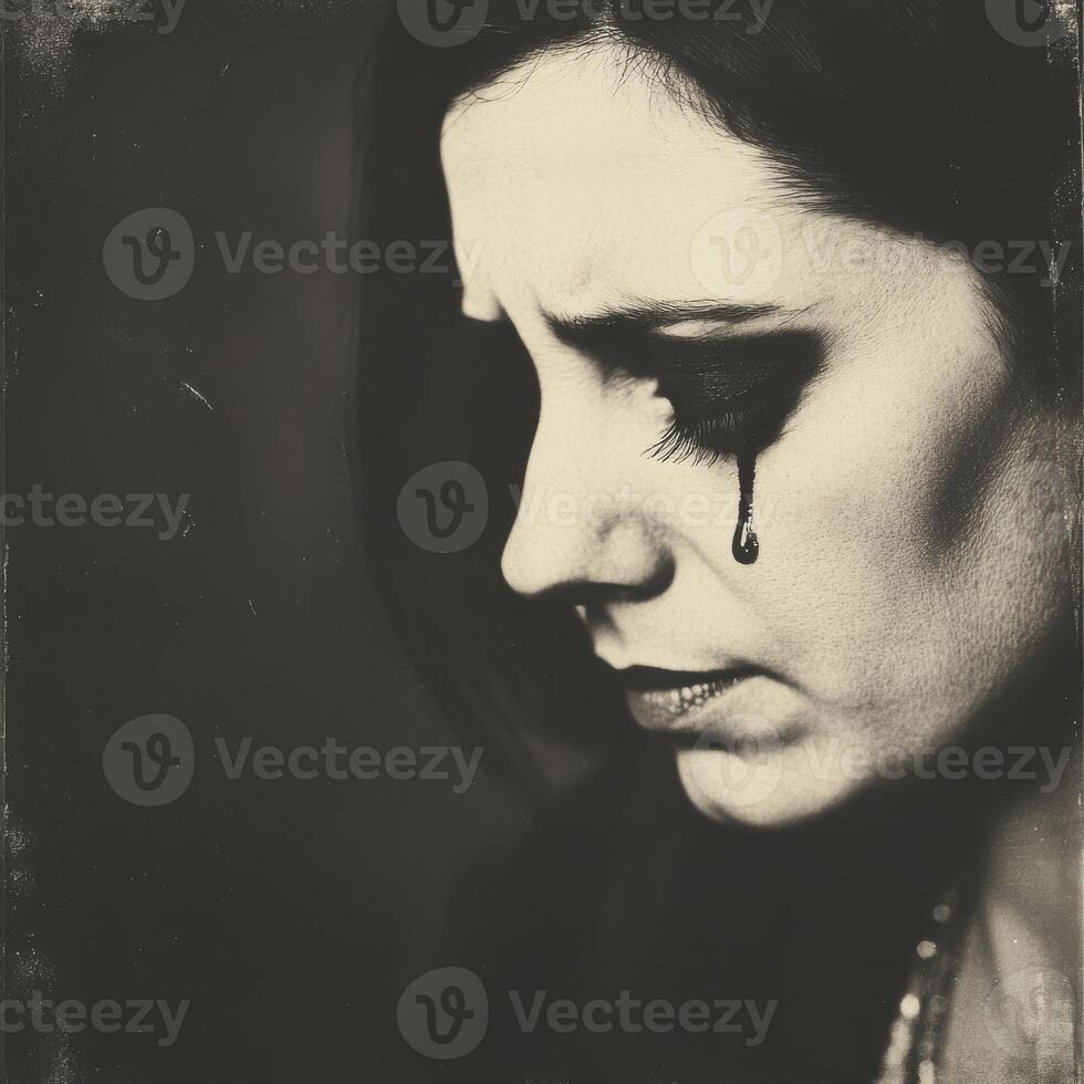 Crying woman with single tear monochrome portrait photo