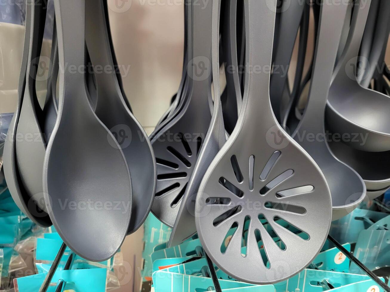 A set of grey silicone cooking utensils photo