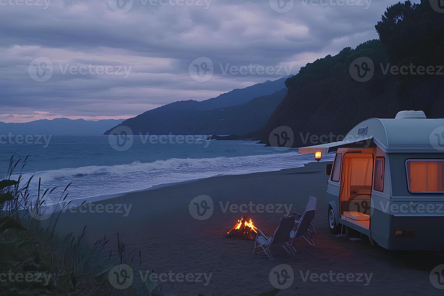 A peaceful camping scene on the beach at sunset, featuring a camper caravan parked by the shore, with the sun setting over the horizon, creating a serene and relaxing atmosphere. photo