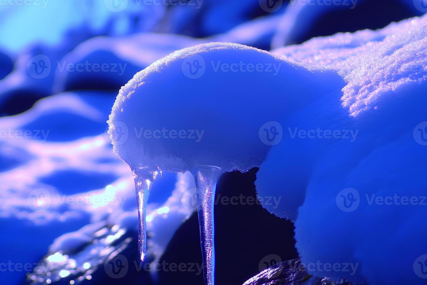 A close-up shot of sparkling icicles hanging from a rock in winter, capturing the intricate details of the frozen formations photo