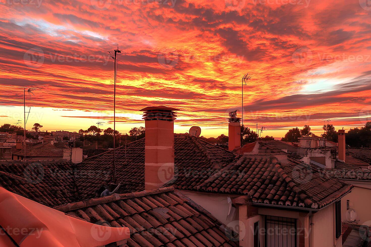 A captivating sunset casting warm golden hues over the rooftops of Tavira's historic old town in Portugal, showcasing its charm and scenic beauty photo