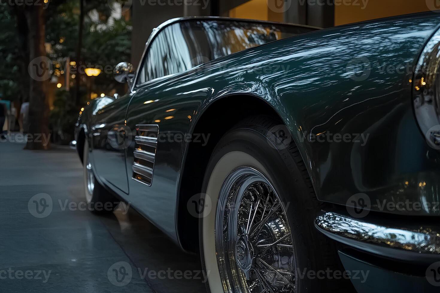 A collection of vintage cars parked in a row on a charming downtown street, highlighting classic design against a bustling city backdrop photo