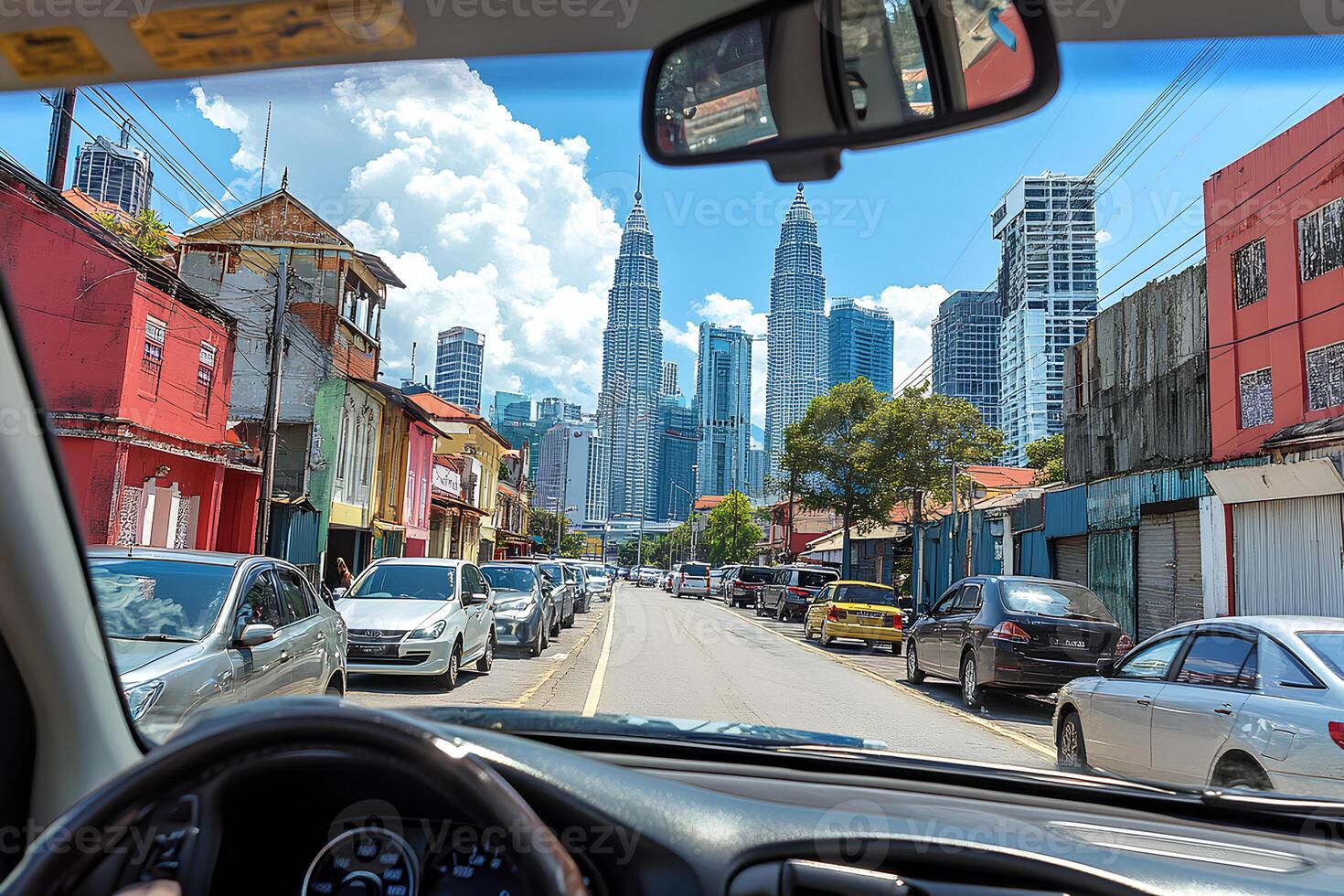 A captivating view from the car showcasing the vibrant and bustling Kuala Lumpur city, with its iconic skyscrapers, busy streets, and the energetic atmosphere of Malaysias capital photo